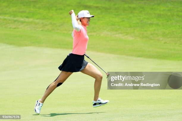 Michelle Wie of the United States celebrates her birdie on the 18th green during the final round of the HSBC Women's World Championship at Sentosa...