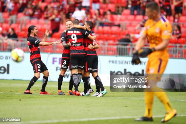 Mark Bridge of the Wanderers celebrates with his team mates after scoring a goal during the round 23 A-League match between the Western Sydney...