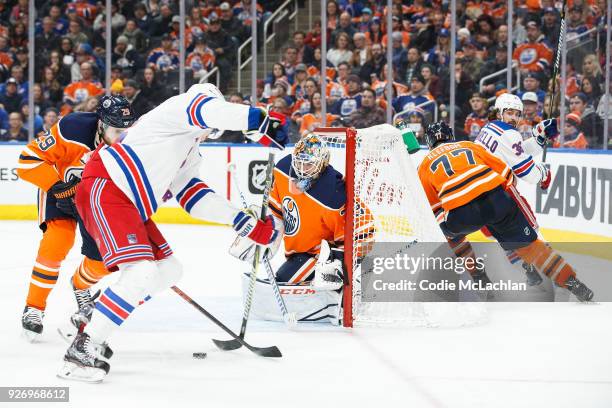 Goaltender Cam Talbot of the Edmonton Oilers shuts the door on Jimmy Vesey of the New York Rangers at Rogers Place on March 3, 2018 in Edmonton,...