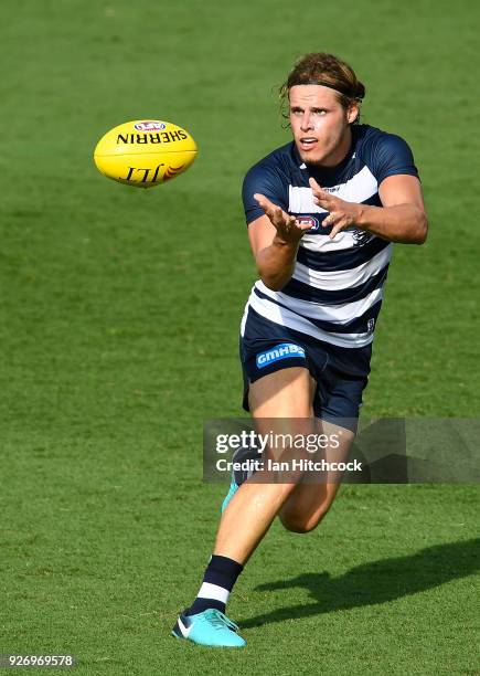 Jake Kolodjashnij of the Cats catches the ball during the AFL JLT Community Series match between the Geelong Cats and the Gold Coast Suns at Riverway...