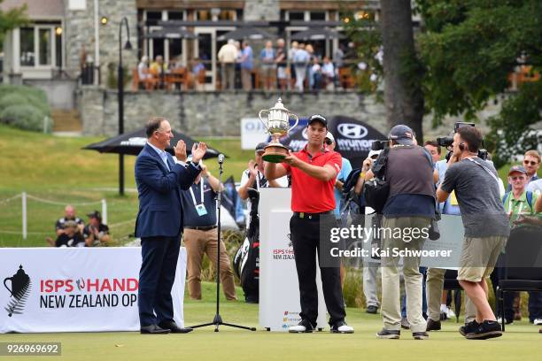 Daniel Nisbet of Australia lifts the Brodie Breeze Challenge Cup during day four of the ISPS Handa New Zealand Golf Open at Millbrook Golf Resort on...