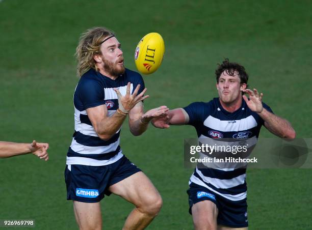 Cameron Guthrie of the Cats takes a mark during the AFL JLT Community Series match between the Geelong Cats and the Gold Coast Suns at Riverway...