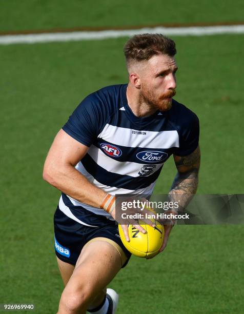 Zach Tuohy of the Cats runs the ball during the AFL JLT Community Series match between the Geelong Cats and the Gold Coast Suns at Riverway Stadium...