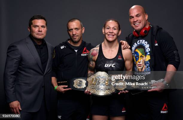 Cris Cyborg of Brazil poses for a portrait backstage with her team after her victory over Yana Kunitskaya of Russia during the UFC 222 event inside...