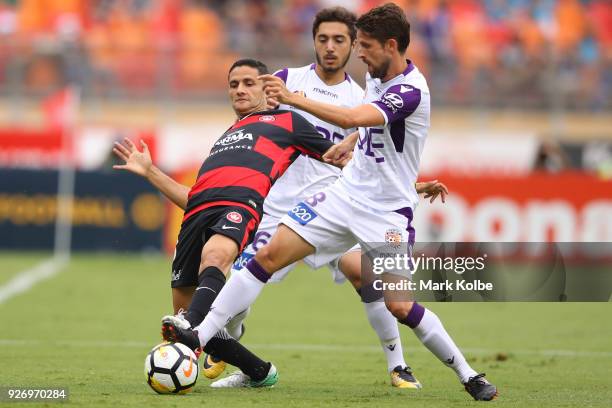 Marcelo Carrusca of the Wanderers and Andreu Guerao of the Glory compete for the ball during the round 23 A-League match between the Western Sydney...