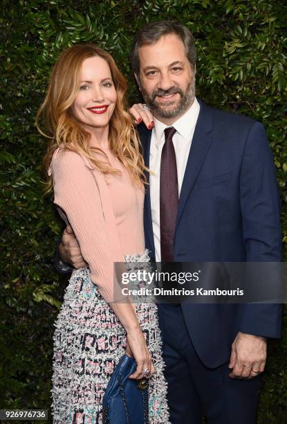 Leslie Mann, wearing CHANEL and Judd Apatow attend Charles Finch and Chanel Pre-Oscar Awards Dinner at Madeo in Beverly Hills on March 3, 2018 in...