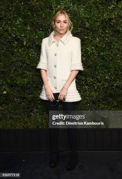 Sienna Miller, wearing CHANEL, attends Charles Finch and Chanel Pre-Oscar Awards Dinner at Madeo in Beverly Hills on March 3, 2018 in Beverly Hills,...