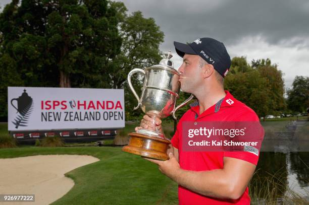 Daniel Nisbet of Australia poses kisses the Brodie Breeze Challenge Cup during day four of the ISPS Handa New Zealand Golf Open at Millbrook Golf...