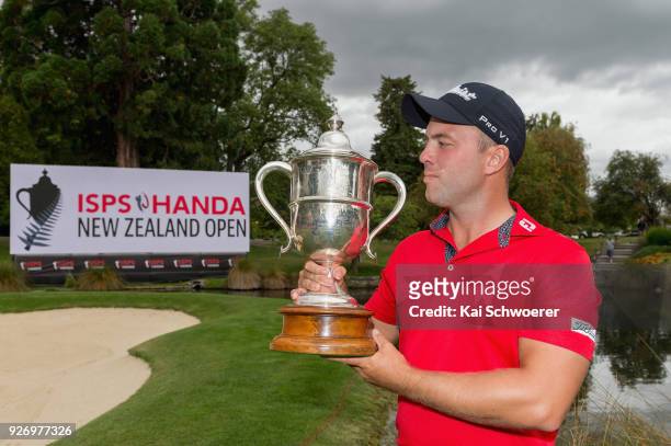 Daniel Nisbet of Australia takes a look at the Brodie Breeze Challenge Cup during day four of the ISPS Handa New Zealand Golf Open at Millbrook Golf...