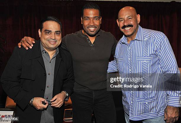 Musicians Gilberto Santa Rosa , Oscar De Leon and DJ Carlos Alvarez attend the 10th Annual Latin GRAMMY Awards Univision Radio Remotes Day 2 held at...