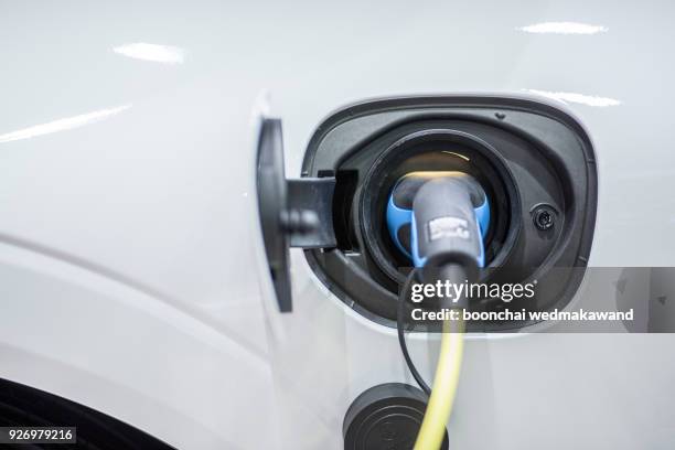 charging of an electric car - car electro stock pictures, royalty-free photos & images