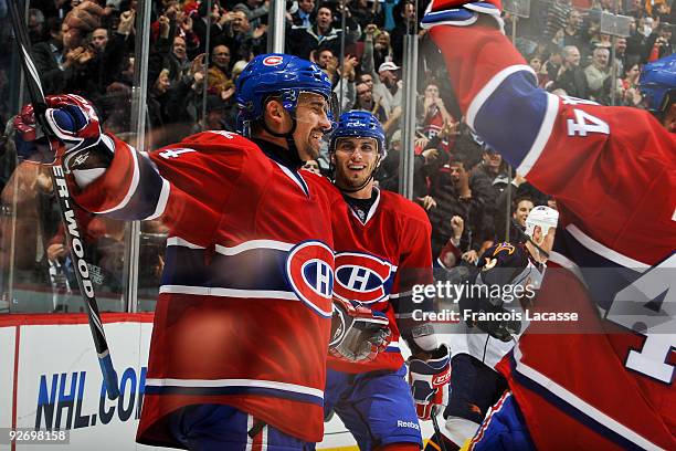 Tomas Plekanec of the Montreal Canadiens celebrates his goal with teammate Maxim Lapierre during the NHL game against the Atlanta Thrashers on...