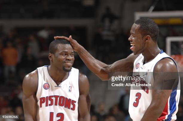 Will Bynum and Rodney Stuckey of the Detroit Pistons joke around on the court during a game against the Orlando Magic in a game at the Palace of...