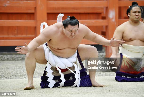 Sumo grand champion Hakuho performs a ceremonial ring-entering ritual at Osaka's Sumiyoshi Taisha shrine on March 3 ahead of the Spring Grand Sumo...
