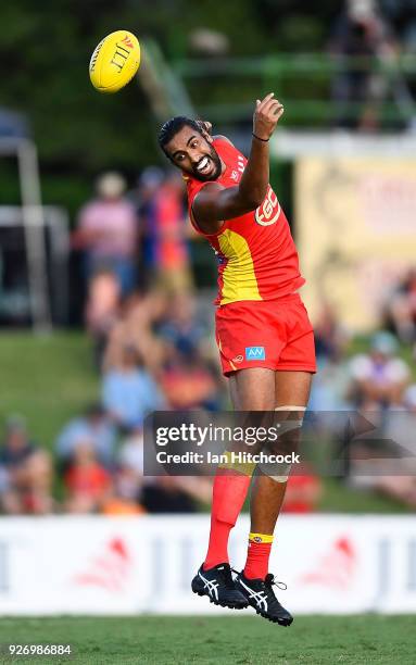 Tom Nicholls of the Suns attempts to catch the ball during the AFL JLT Community Series match between the Geelong Cats and the Gold Coast Suns at...