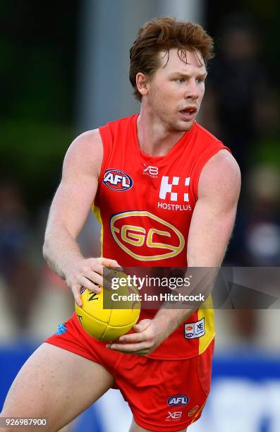Jesse Joyce of the Suns runs the ball during the AFL JLT Community Series match between the Geelong Cats and the Gold Coast Suns at Riverway Stadium...