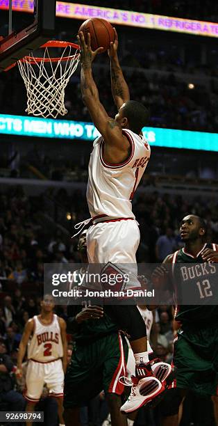 Derrick Rose of the Chicago Bulls goes up for a dunk over Luc Mbah a Moute of the Milwaukee Bucks at the United Center on November 3, 2009 in...
