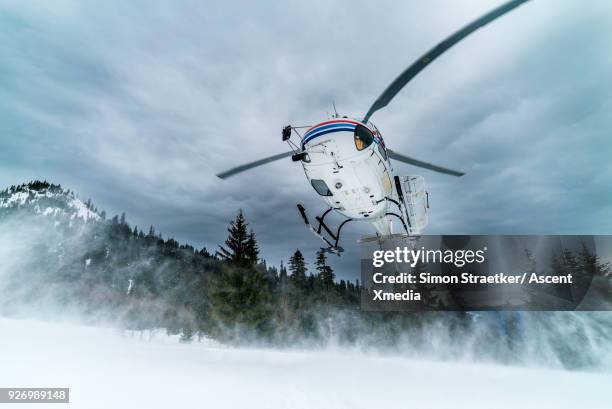 helicopter arrives on snow crest with heli-skiers - helikopter bildbanksfoton och bilder