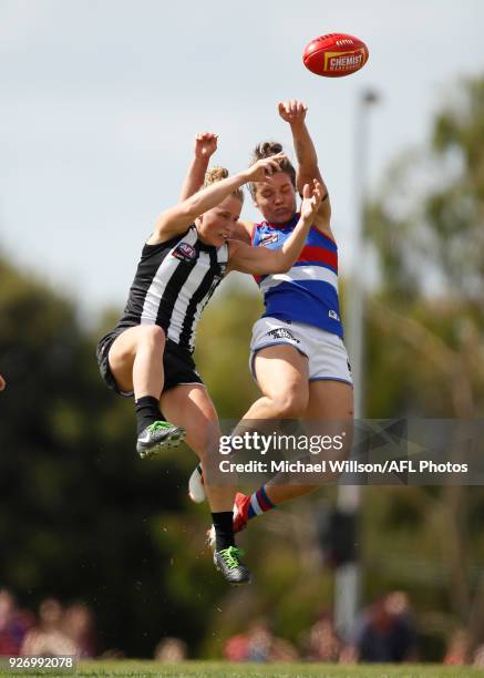 Ellie Blackburn of the Bulldogs and Jaimee Lambert of the Magpies compete for the ball during the 2018 AFLW Round 05 match between the Collingwood...
