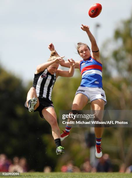 Ellie Blackburn of the Bulldogs and Jaimee Lambert of the Magpies compete for the ball during the 2018 AFLW Round 05 match between the Collingwood...