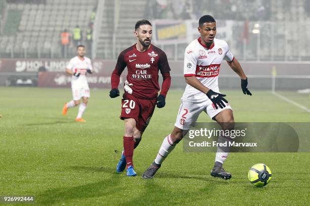 Julian Palmieri of Metz and Kelvin Amian of Toulouse during the Ligue 1 match between Metz and Toulouse at on March 3, 2018 in Metz, .