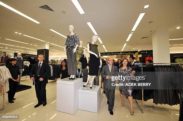 British Minister for Trade, Investment and Small Business Mervyn Davies visits a Mark and Spencer retail shop at the Plaza Indonesia shopping center...