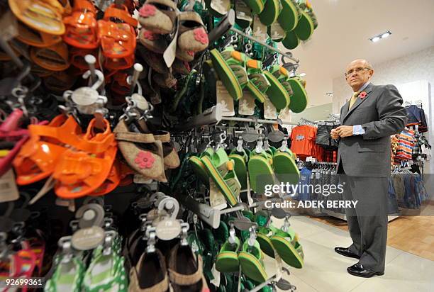 British Minister for Trade, Investment and Small Business Mervyn Davies visits a Mothercare shop at the Plaza Indonesia shopping center in Jakarta on...