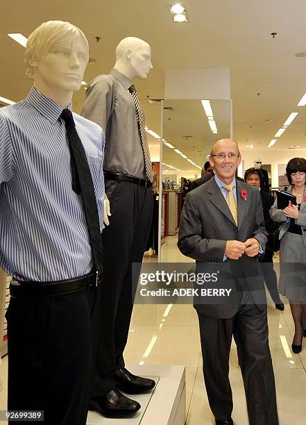 British Minister for Trade, Investment and Small Business Mervyn Davies visits a Mark and Spencer shop at the Plaza Indonesia shopping center in...