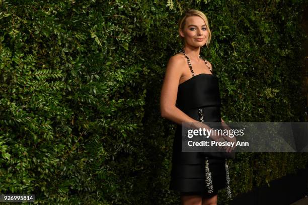 Margot Robbie attends Charles Finch And Chanel Pre-Oscar Awards Dinner At Madeo in Beverly Hills at Madeo Restaurant on March 3, 2018 in Los Angeles,...