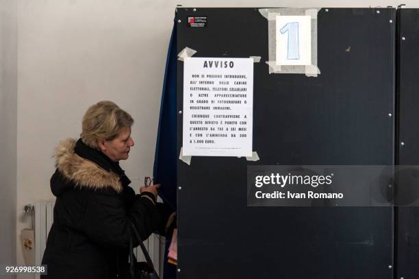 Italian citizens go to the polls to cast their votes to elect a new Italian government on March 4, 2018 in Pontecagnano Faiano, Italy. The economy...