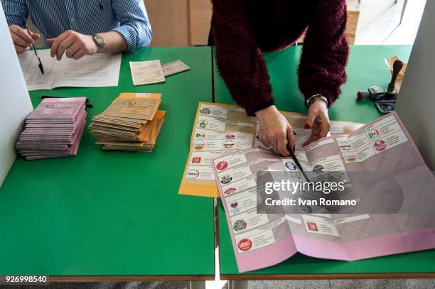 Italian citizens go to the polls to cast their votes to elect a new Italian government on March 4, 2018 in Pontecagnano Faiano, Italy. The economy...