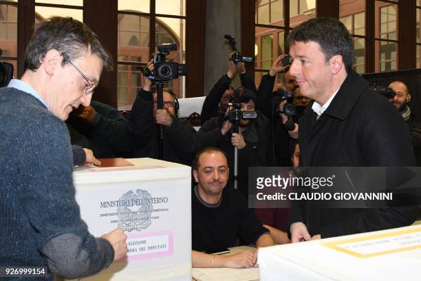 Former Prime Minister and leader of the Democratic Party , Matteo Renzi , votes on March 4, 2018 at a polling station in Florence. Italians vote...