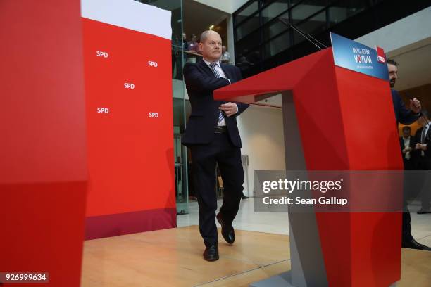 Olaf Scholz, Acting Chairman of the German Social Democrats , arrives to speak to journalists following the SPD member vote over the party's...