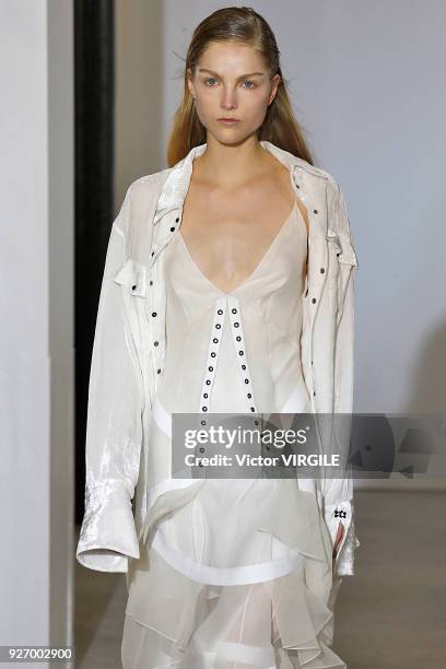 Model walks the runway during the Olivier Theyskens Ready to Wear fashion show as part of the Paris Fashion Week Womenswear Fall/Winter 2018/2019 on...