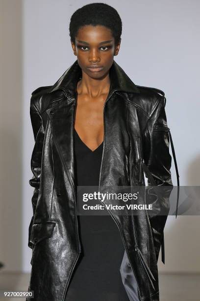 Model walks the runway during the Olivier Theyskens Ready to Wear fashion show as part of the Paris Fashion Week Womenswear Fall/Winter 2018/2019 on...