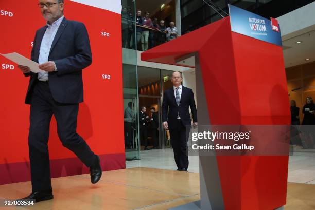 Olaf Scholz , Acting Chairman of the German Social Democrats , and SPD Treasurer Dietmar Nietan arrive to speak to journalists following the SPD...