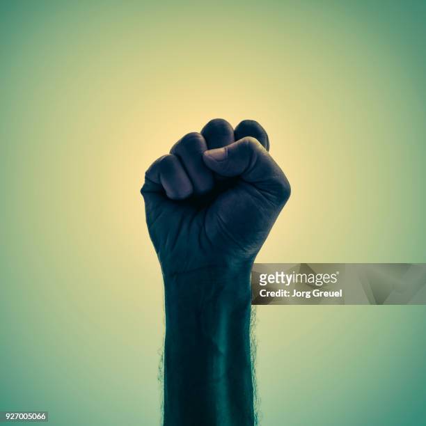 male fist - thumb war stock pictures, royalty-free photos & images
