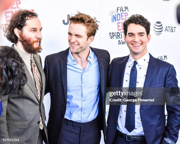 Director Josh Safdie, actor Robert Pattinson, and director Benny Safdie attend the 2018 Film Independent Spirit Awards on March 3, 2018 in Santa...