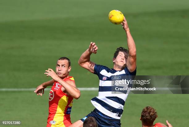 Jarrod Witts of the Suns and Rhys Stanley of the Cats contest the ball during the AFL JLT Community Series match between the Geelong Cats and the...