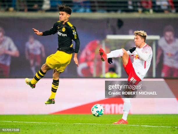 Dortmund's German midfielder Mahmoud Dahoud and Leipzig's Slovanian midfielder Kevin Kampl vie for the ball during the German first division...