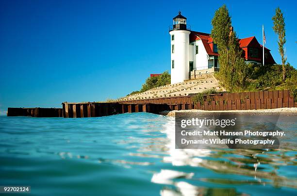 lighthouse at lake michigan - lake michigan stock pictures, royalty-free photos & images