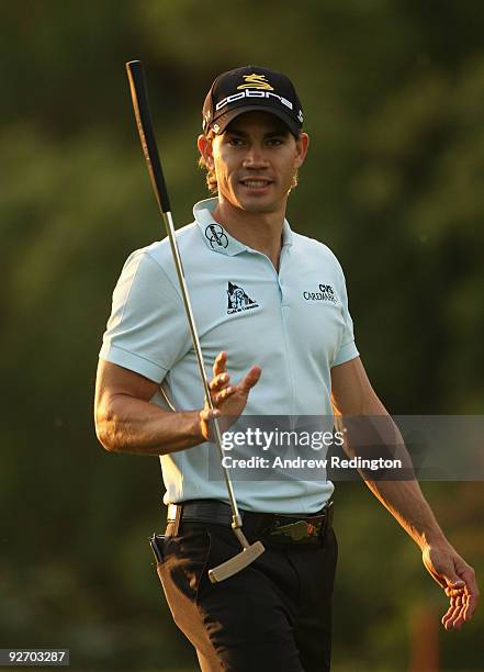 Camilo Villegas of Colombia walks towards his ball on the eighth hole during the pro-am prior to the start of the WGC-HSBC Champions at Sheshan...