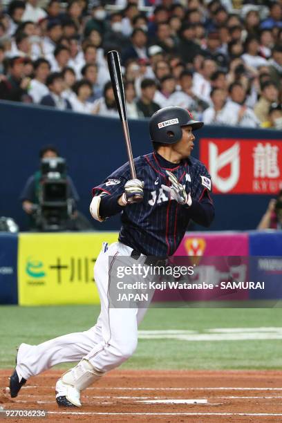 Shogo Akiyama of Japan hits a RBI single in the top half of the second inning during the game two of the baseball international match between Japan...