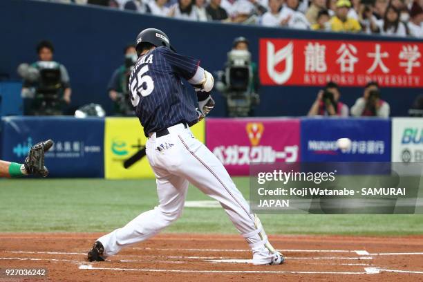 Shogo Akiyama of Japan hits a RBI single in the top half of the second inning during the game two of the baseball international match between Japan...