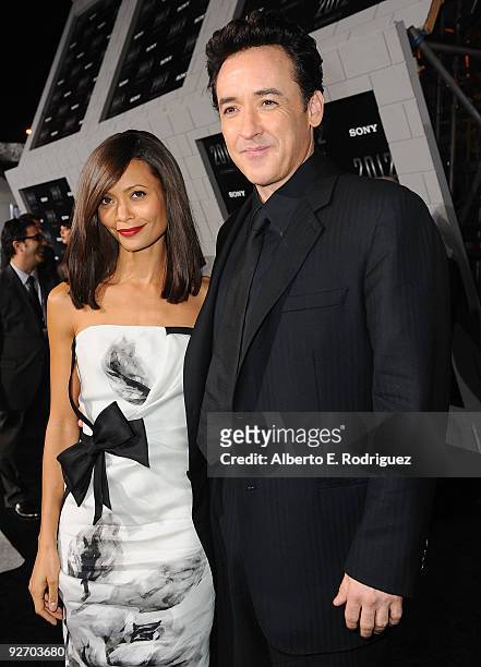 Actress Thandie Newton and actor John Cusack arrive at the premiere of Columbia Pictures' "2012" at the Regal Cinemas LA live on November 3, 2009 in...