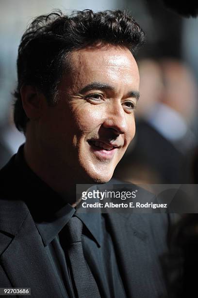 Actor John Cusack arrives at the premiere of Columbia Pictures' "2012" at the Regal Cinemas LA live on November 3, 2009 in Los Angeles, California.