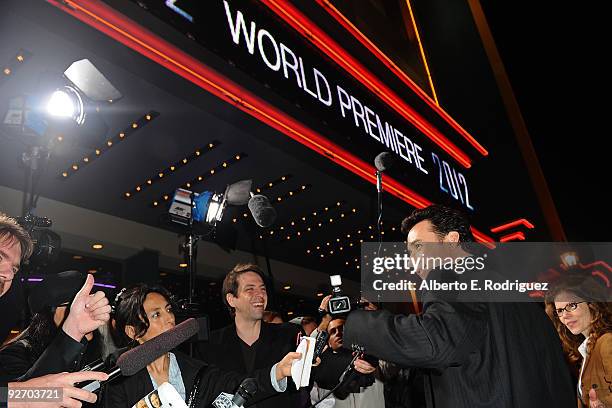 Actor John Cusack arrives at the premiere of Columbia Pictures' "2012" at the Regal Cinemas LA live on November 3, 2009 in Los Angeles, California.