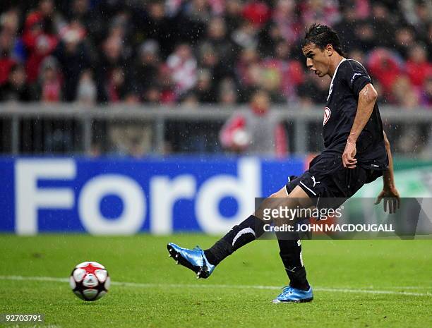 Bordeaux' Moroccan striker Marouane Chamakh scores during the Bayern Munich vs Girondins de Bordeaux Champions League Group A football match in...