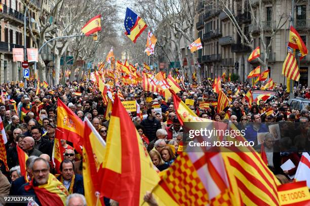 People hold Spanish flags during a pro-unity rally organized by the Tabarnia movement, a fictional region that wants independence from Catalonia, on...