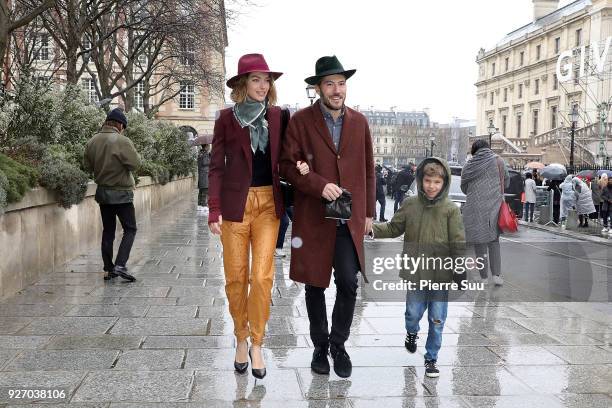 Arizona Muse is seen leaving the the Givenchy show with her husband Boniface Verney-Carron and her son Nikko Quintana as part of the Paris Fashion...